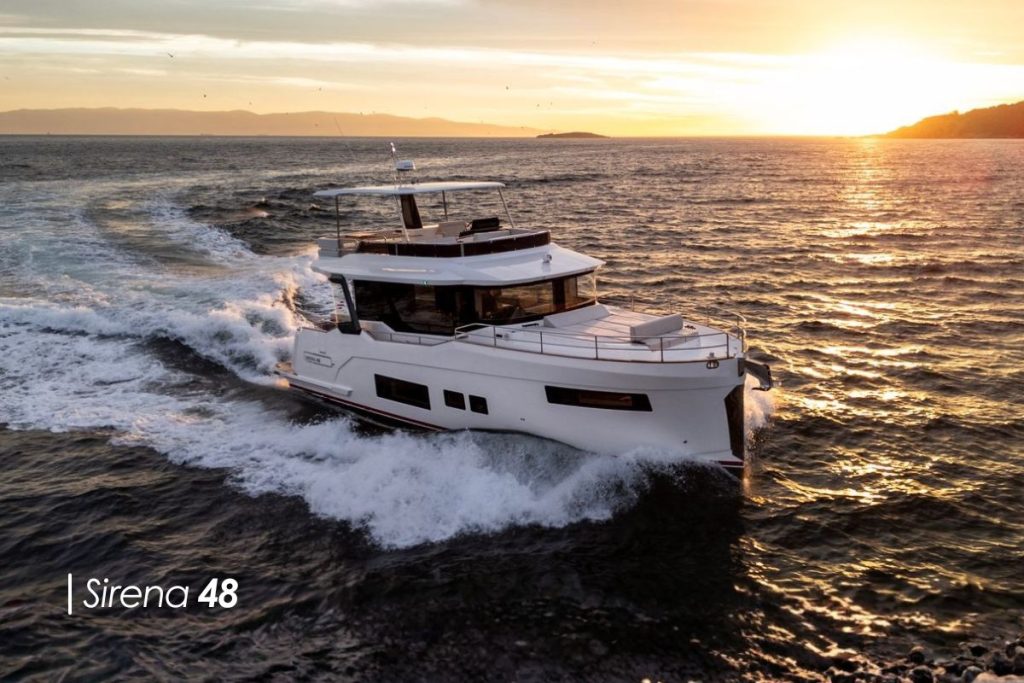 Luxury motor yacht sailing at high speed in open waters.