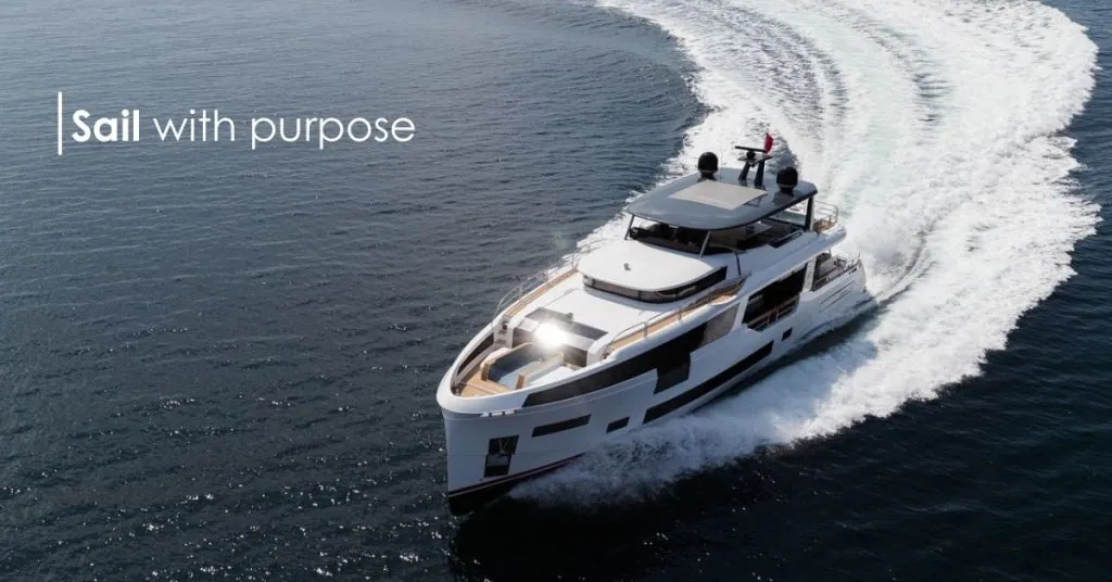 A luxury yacht sailing on the high seas at sunset, representing Camino al Mare's values of freedom and precision.